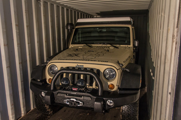 The Jeep locked and loaded into the 20 foot shipping container. It's got about 6 inches all round.